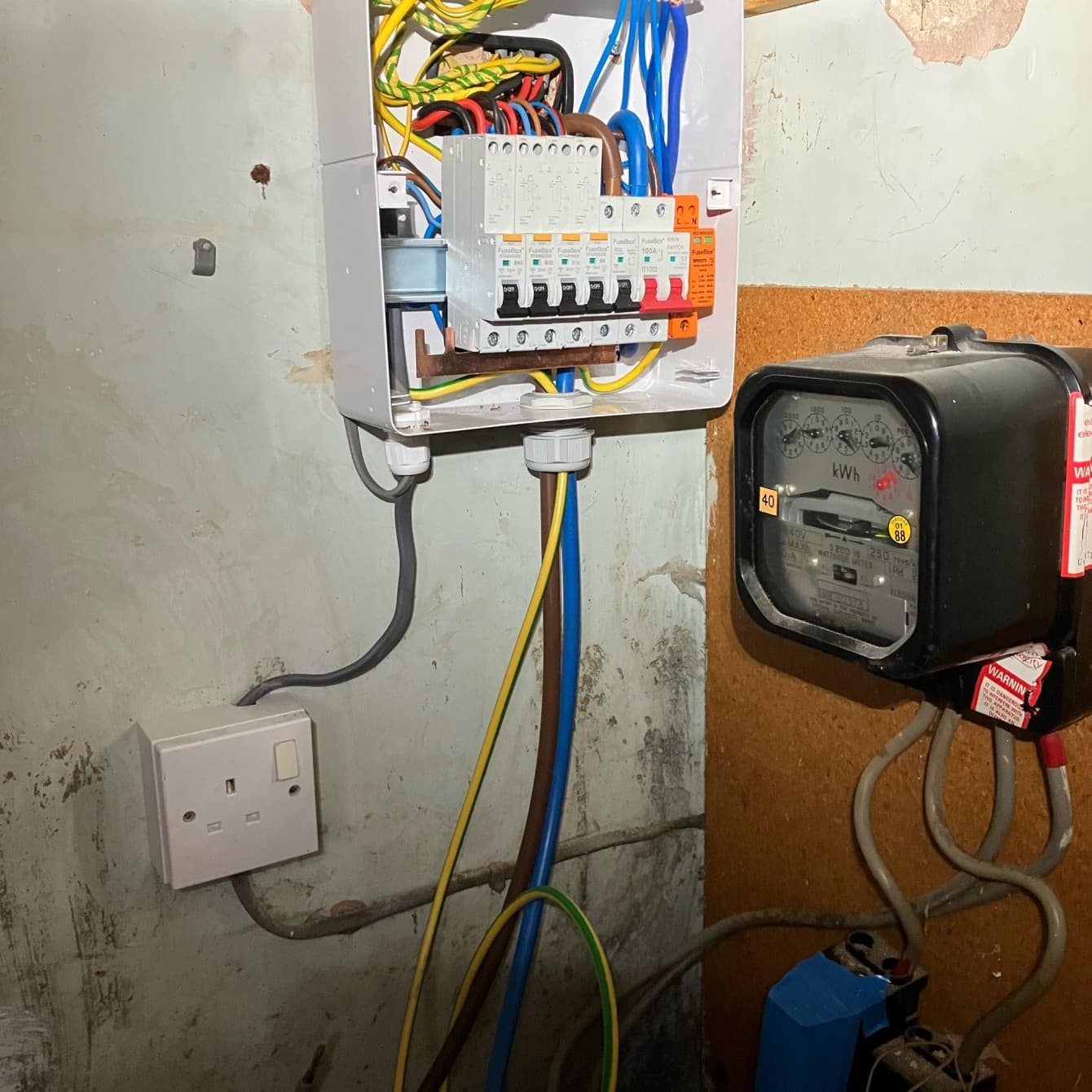 New consumer unit fitted beside the property's original electricity meter