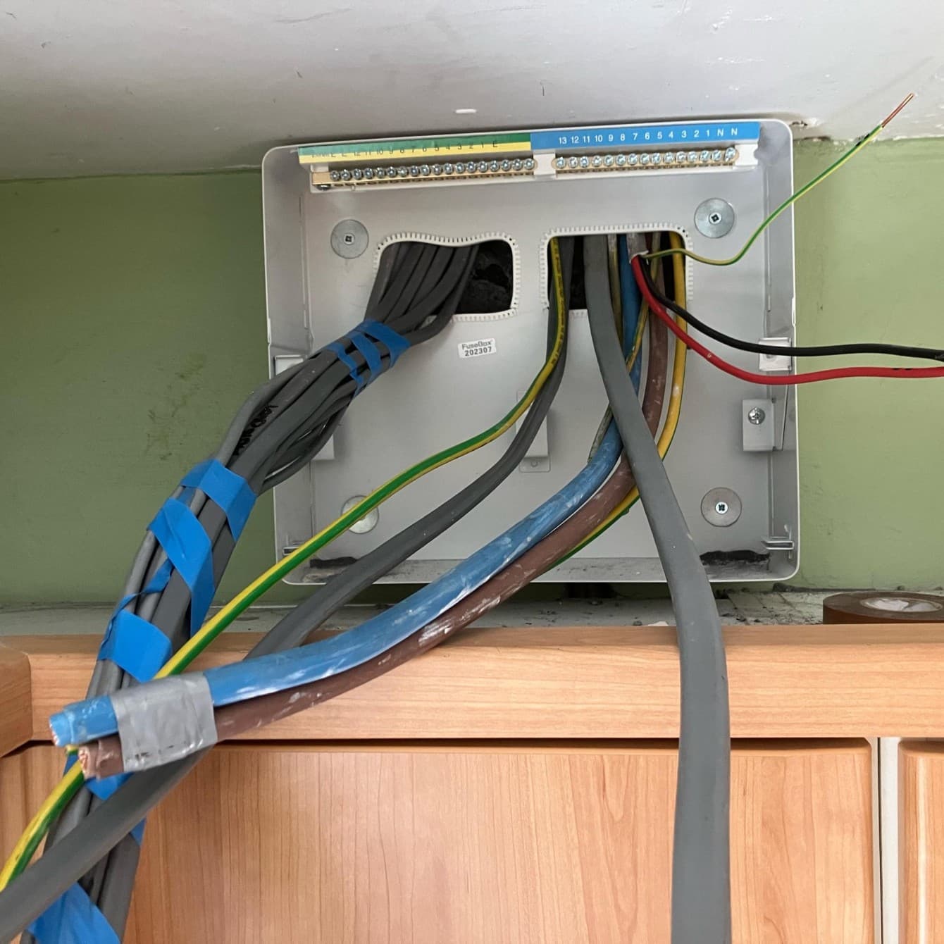 New circuits run back to the board backplate before the cover and plastering go on